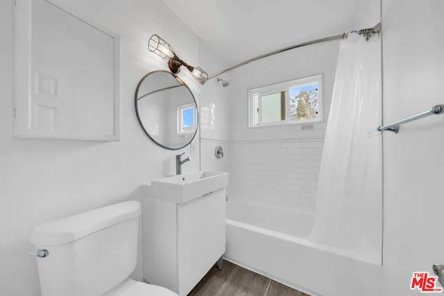 a bathroom with a sink a toilet and a bathtub