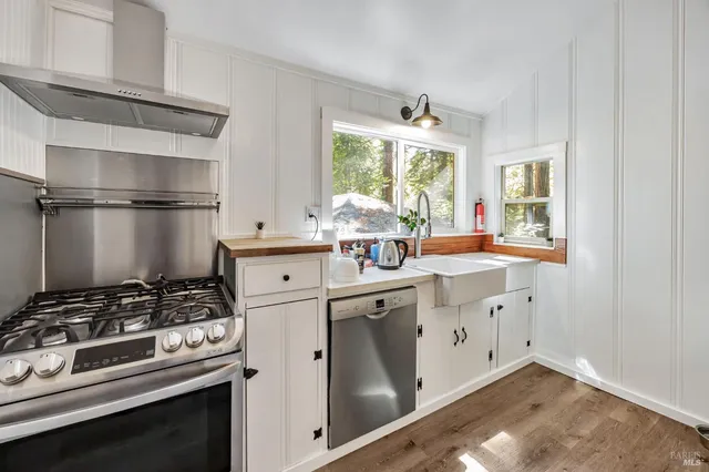 a kitchen with a stove and a sink