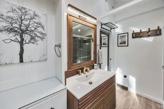 a bathroom with a sink and a mirror