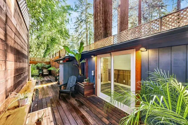 a view of balcony with chairs and wooden floor