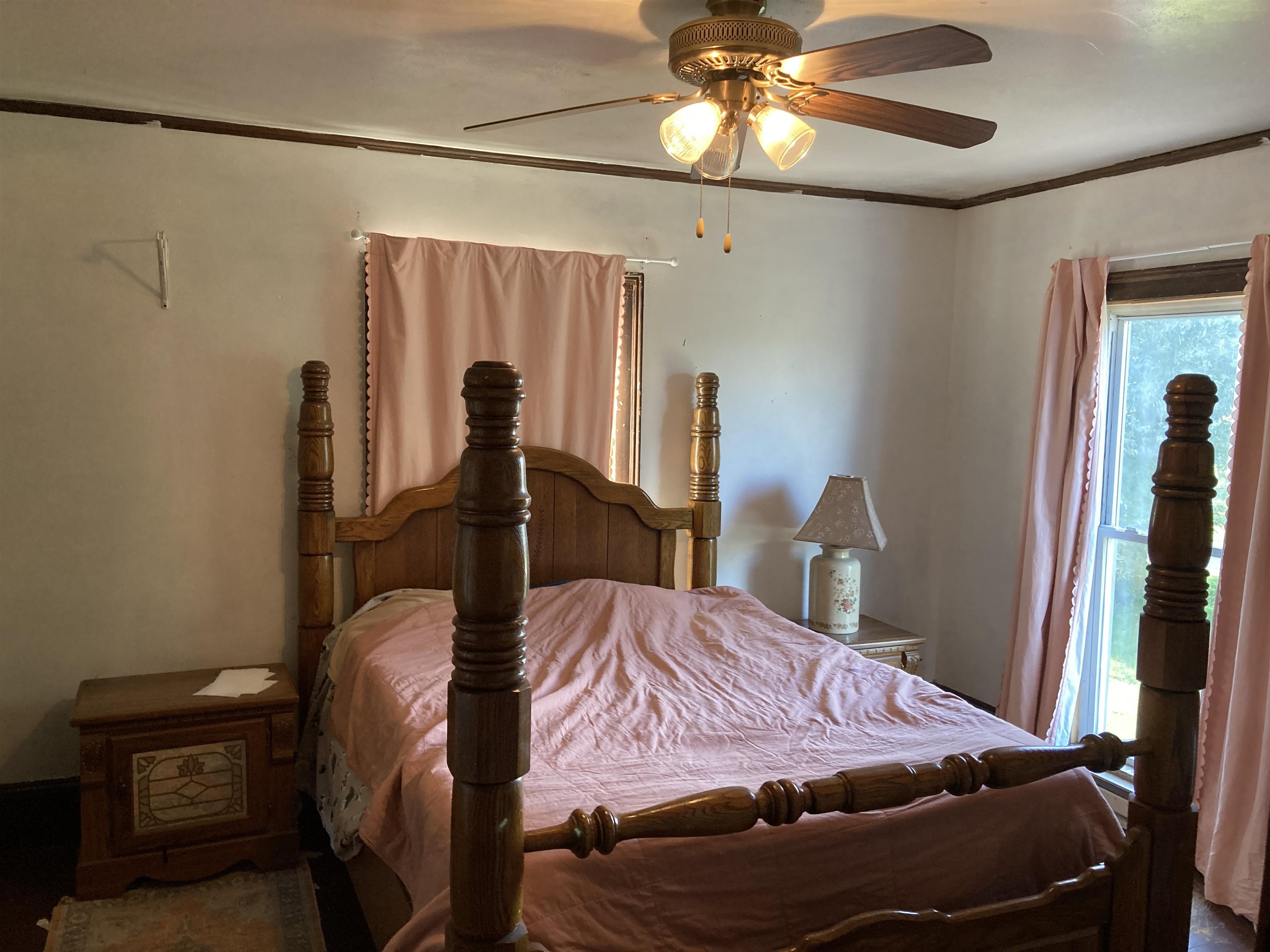 15702 Farm School Road Durand, IL 61024 - Photo 25 of 38 a bedroom with a bed and a chandelier