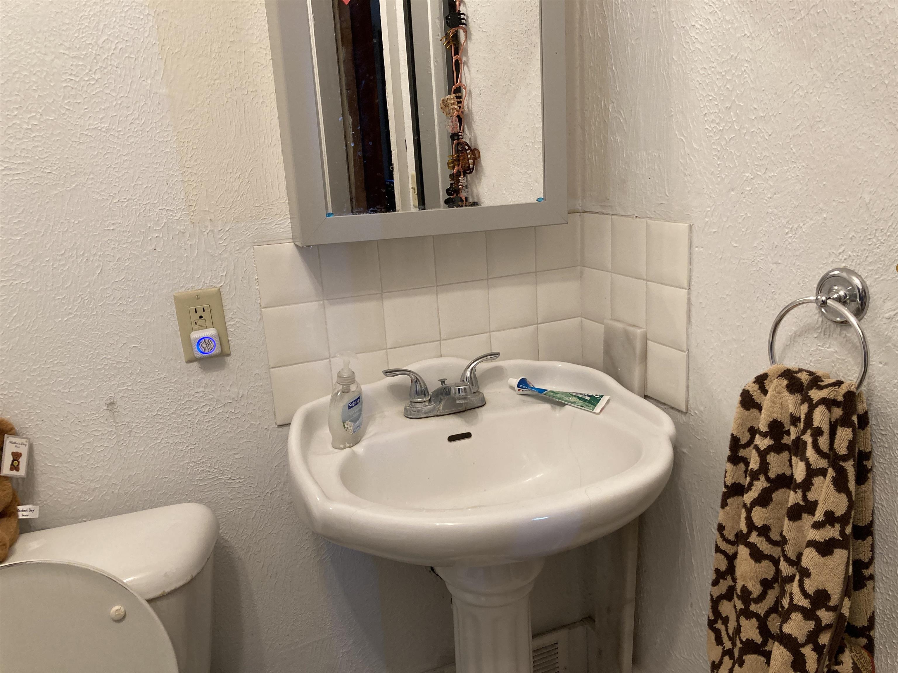 15702 Farm School Road Durand, IL 61024 - Photo 27 of 38 a bathroom with a sink and a toilet