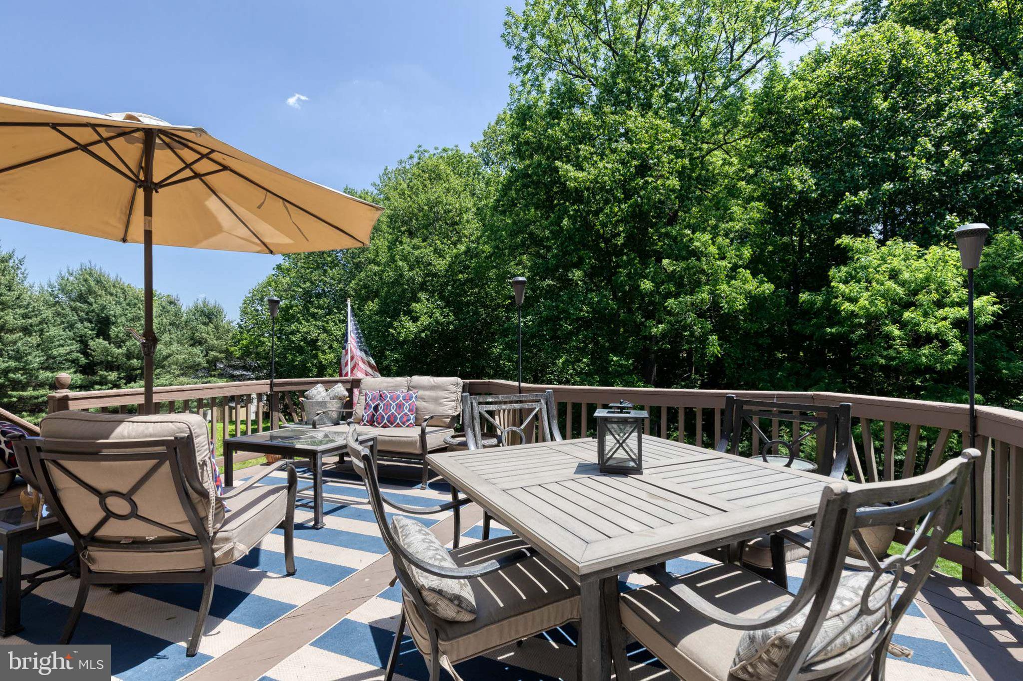 9741 Starling Road Ellicott City, MD 21042 - Photo 54 of 64 Serene deck retreat amidst lush greenery.