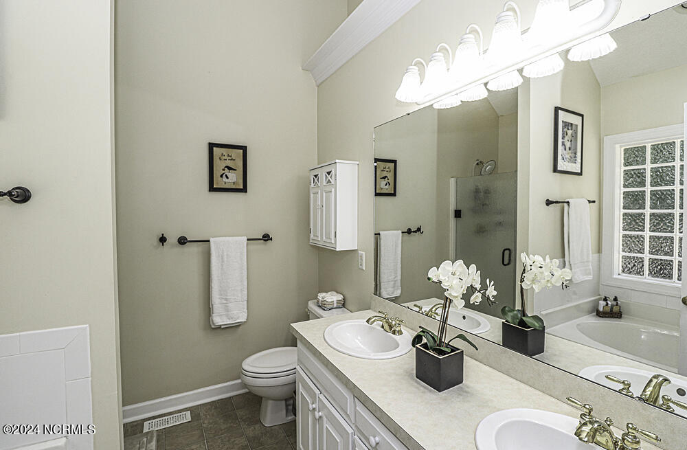 3598 Carriage Farm Road Rocky Mount, NC 27804 - Photo 9 of 19 His and her vanities and walk in shower!
