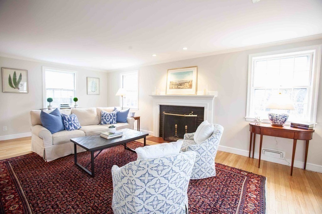 39 River Glen Road Wellesley, MA 02481 - Photo 2 of 16 a living room with furniture and a fireplace