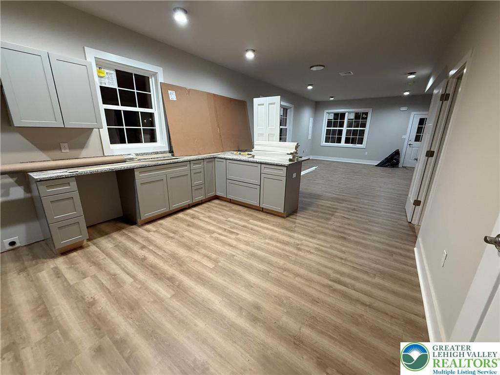 1722 Williams Street Hellertown, PA 18055 - Photo 3 of 12 a kitchen with stainless steel appliances kitchen island granite countertop a sink and cabinets