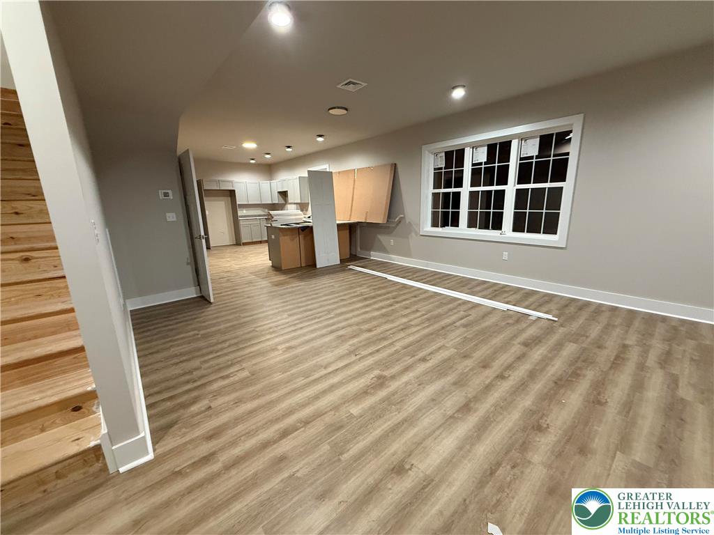 1722 Williams Street Hellertown, PA 18055 - Photo 6 of 12 a view of a livingroom with wooden floor and staircase