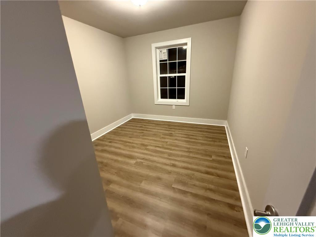 1722 Williams Street Hellertown, PA 18055 - Photo 8 of 12 a view of an empty room with windows