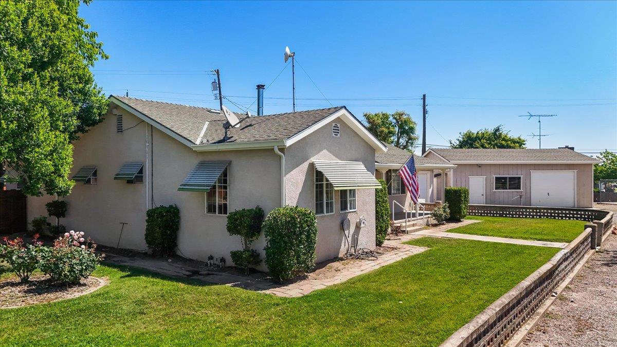 4701 Lone Tree Road Valley Home, CA 95361 - Photo 7 of 59 a front view of a house with a yard