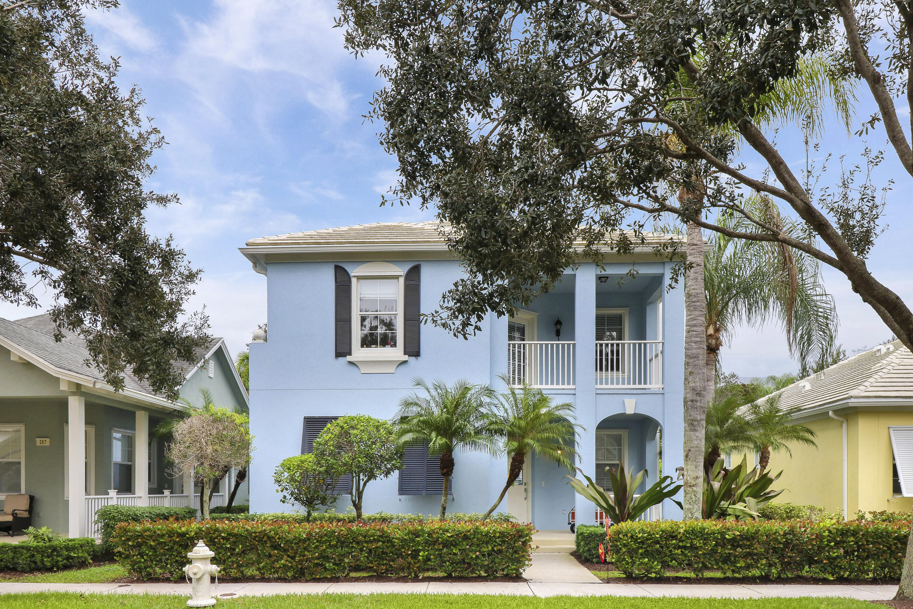 front view of a house with a garden