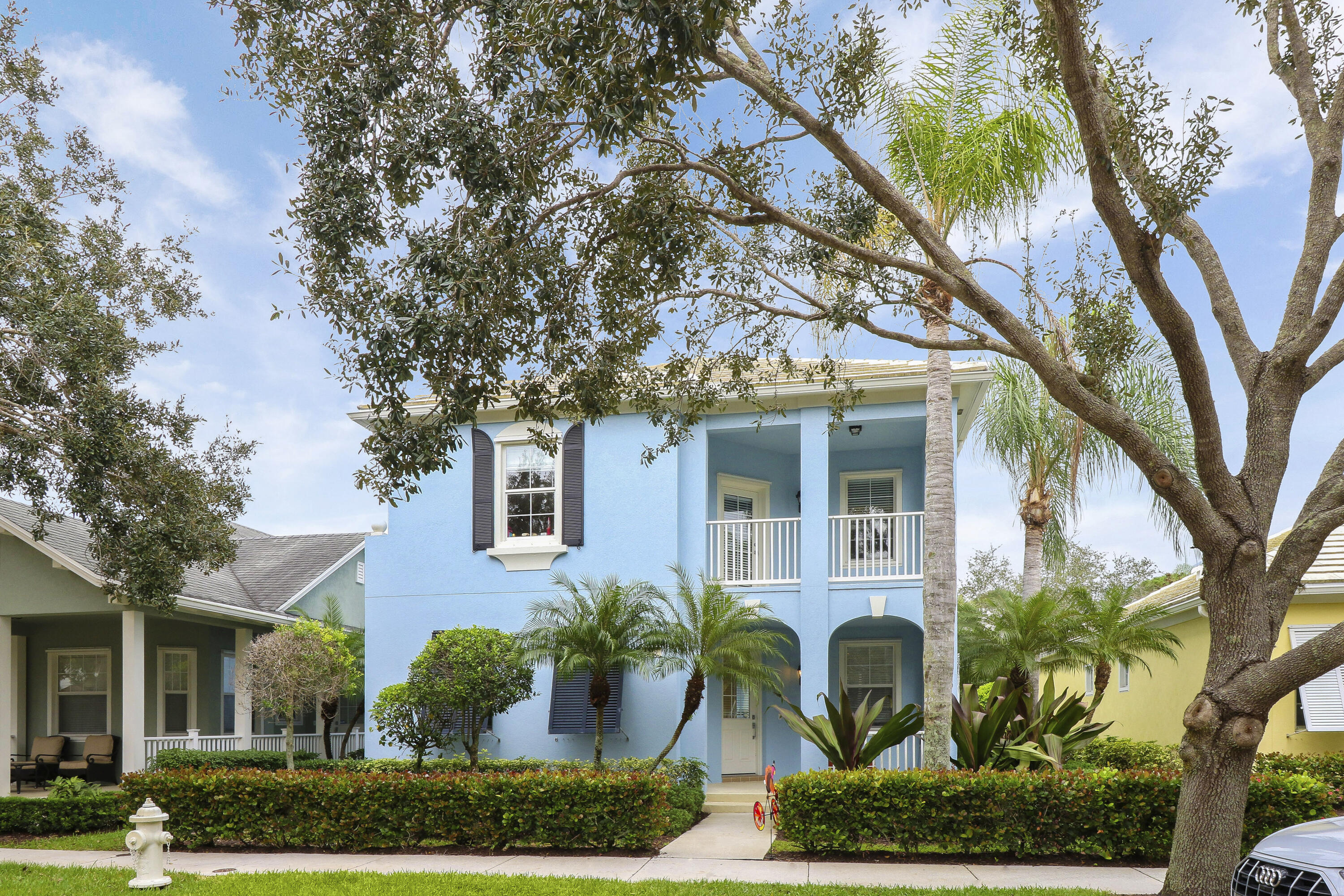263 Caravelle Drive Jupiter, FL 33458 - Photo 13 of 14 front view of a house with a garden