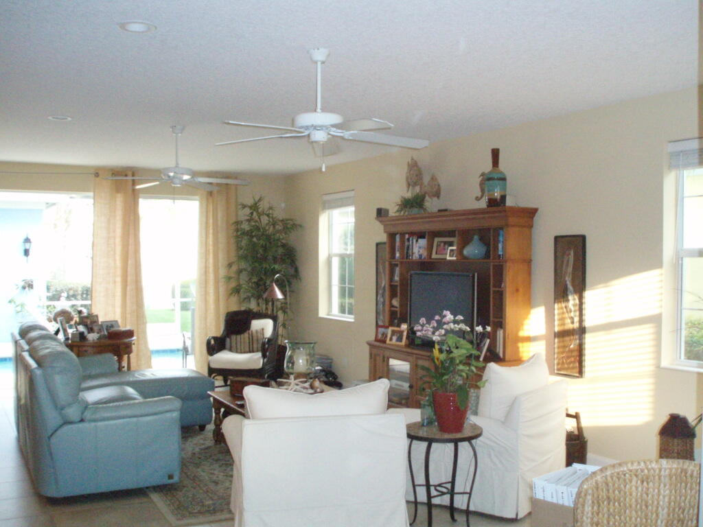 263 Caravelle Drive Jupiter, FL 33458 - Photo 6 of 14 a living room with furniture and chandelier