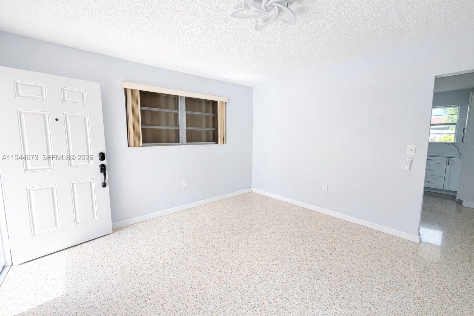 11333 Southwest 7th Terrace Sweetwater, FL 33174 - Photo 3 of 13 an empty room with a natural light