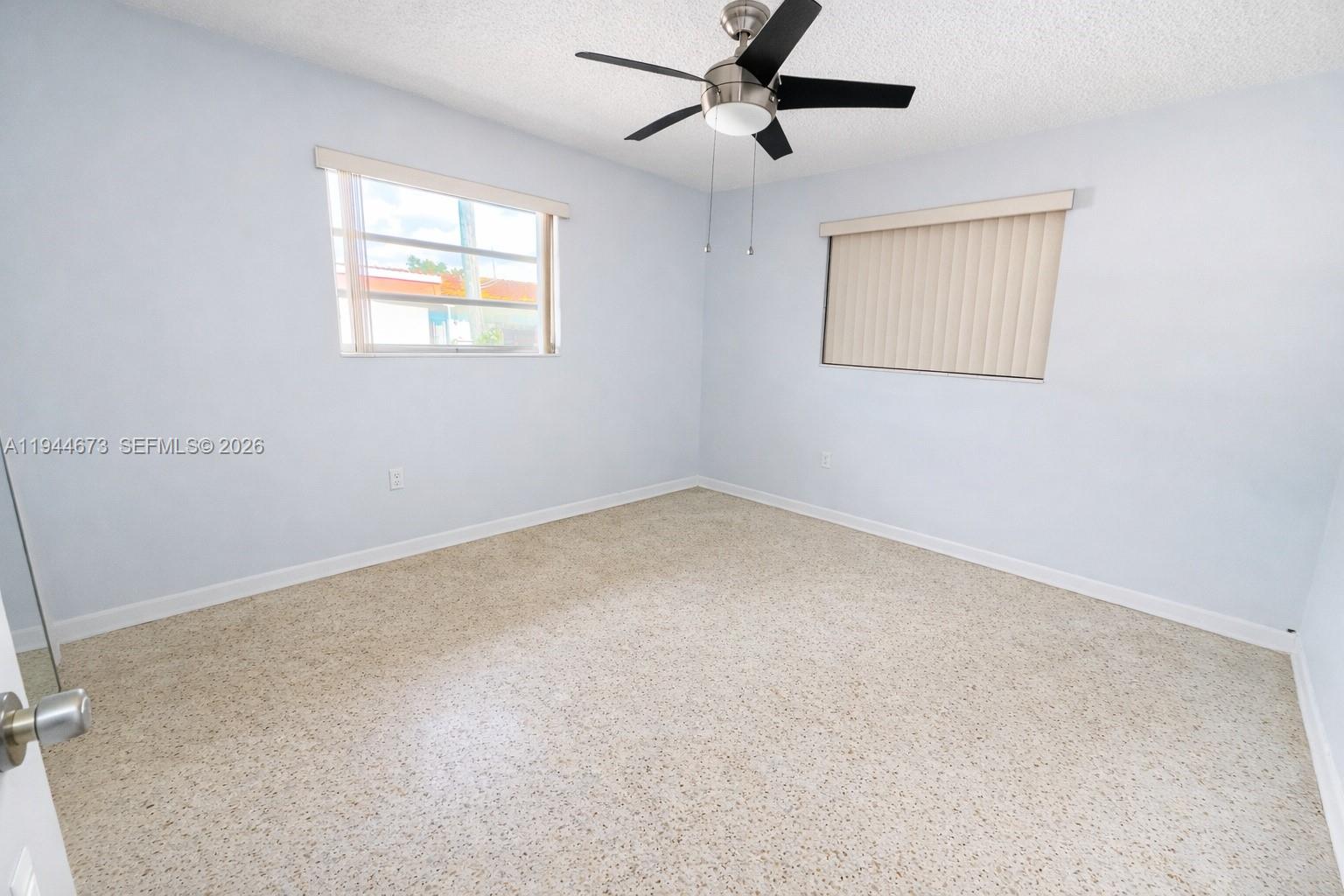 11333 Southwest 7th Terrace Sweetwater, FL 33174 - Photo 6 of 13 an empty room with windows
