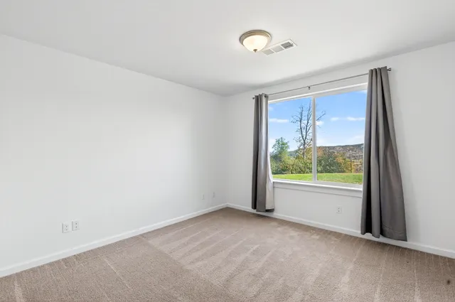 an empty room with window