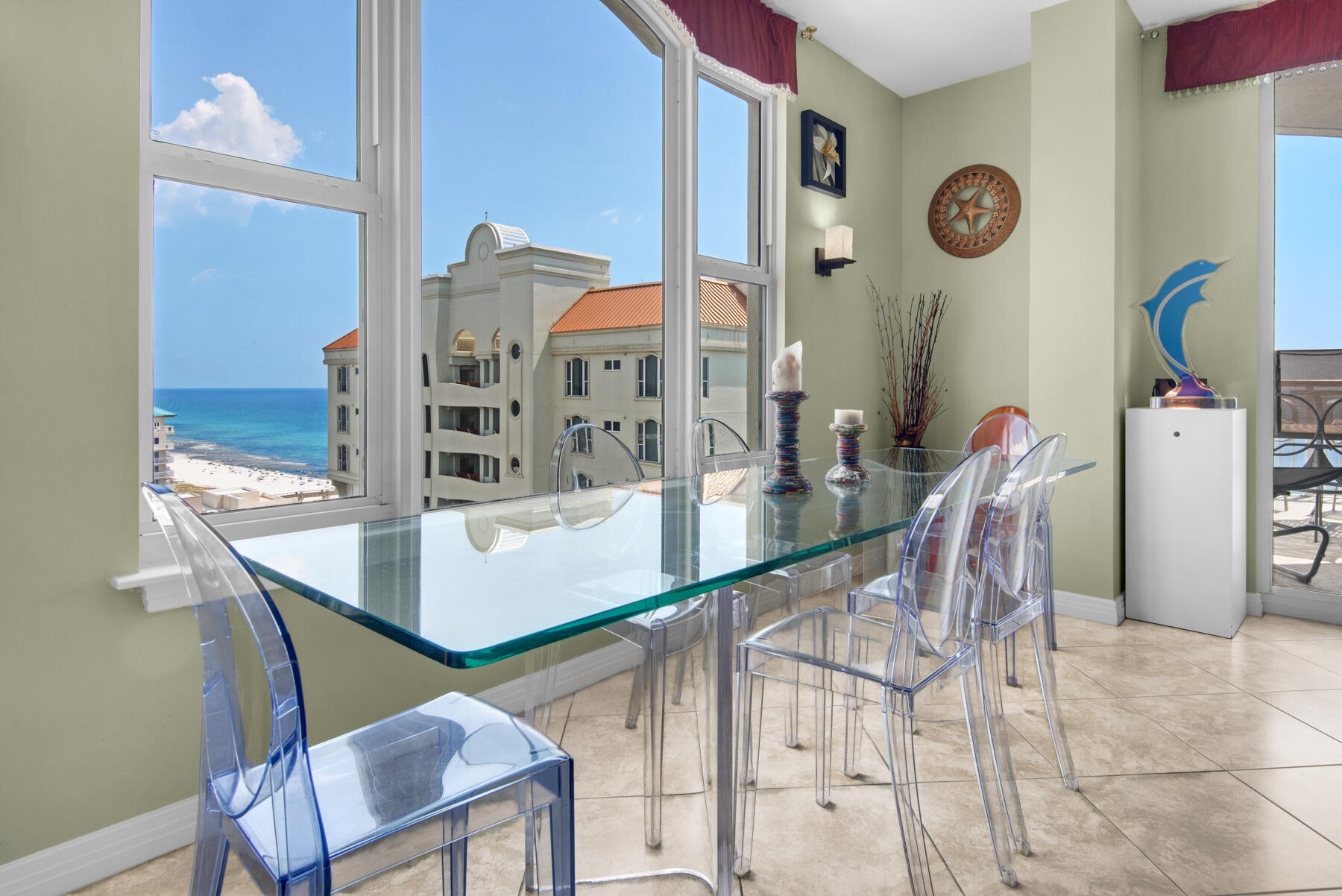 8501 Gulf Boulevard, Unit WPH3A Navarre, FL 32566 - Photo 11 of 66 a dining room with furniture and window