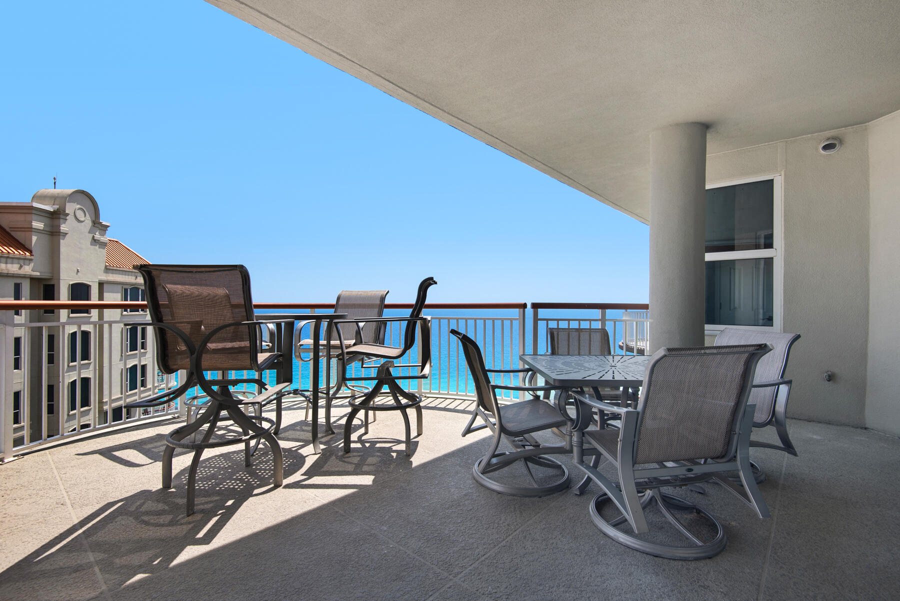 8501 Gulf Boulevard, Unit WPH3A Navarre, FL 32566 - Photo 20 of 66 a view of a patio with table and chairs