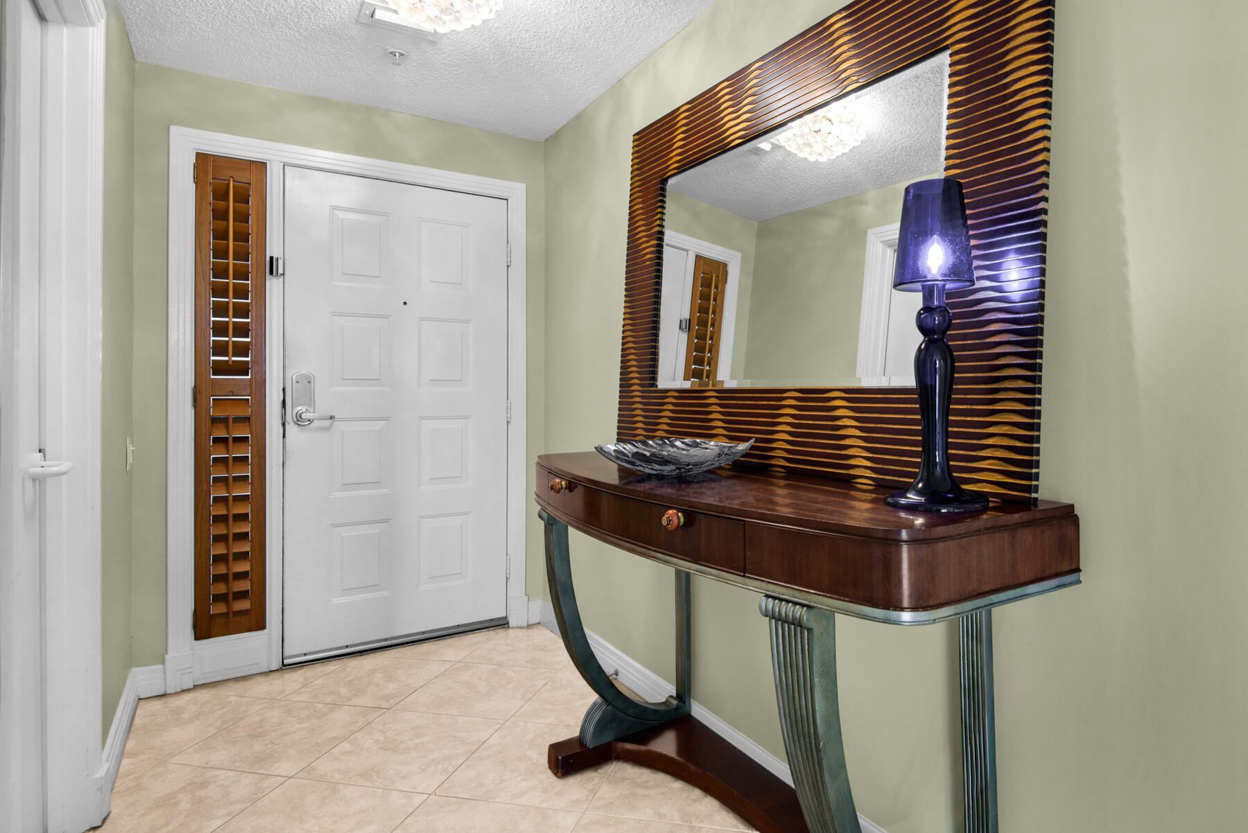 8501 Gulf Boulevard, Unit WPH3A Navarre, FL 32566 - Photo 2 of 66 a bathroom with a sink a toilet and mirror