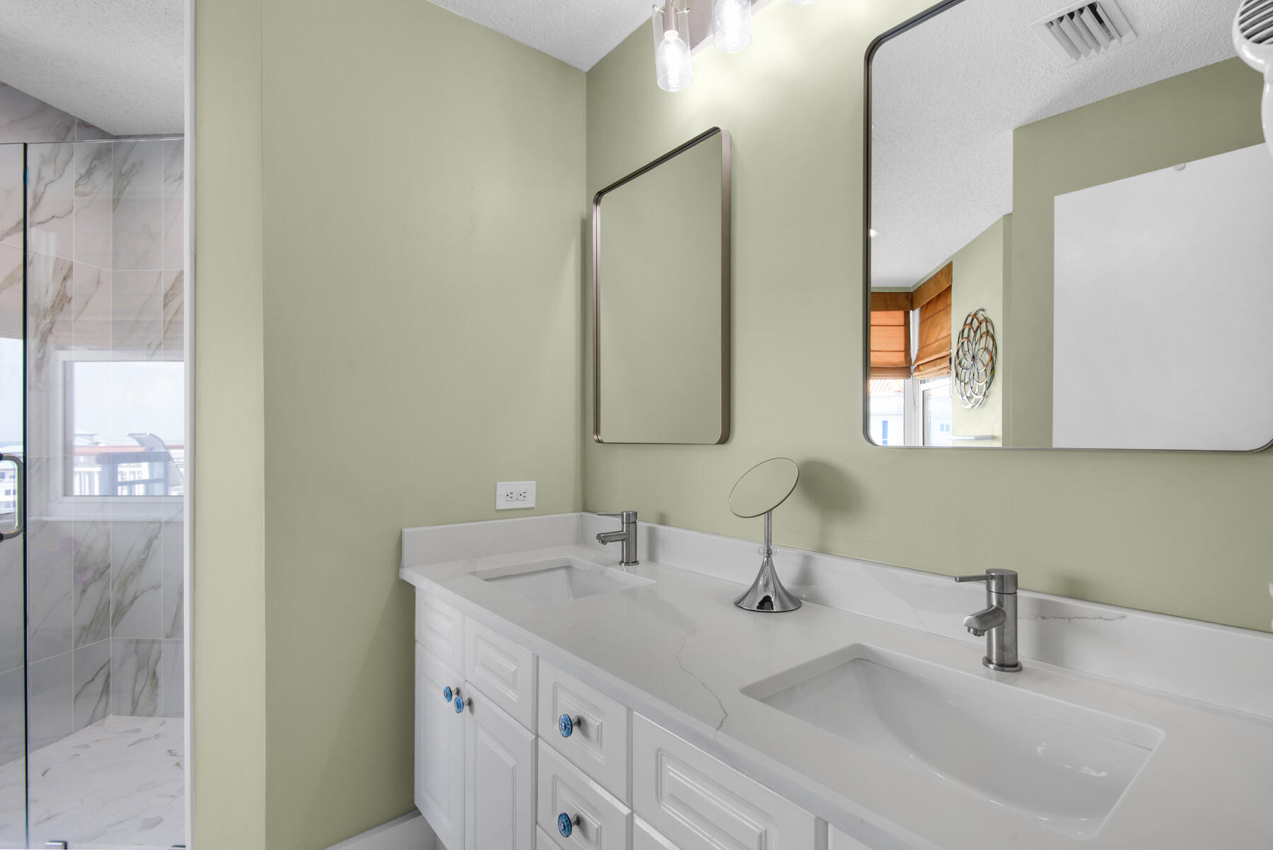 8501 Gulf Boulevard, Unit WPH3A Navarre, FL 32566 - Photo 34 of 66 a bathroom with 2 sink and a mirror