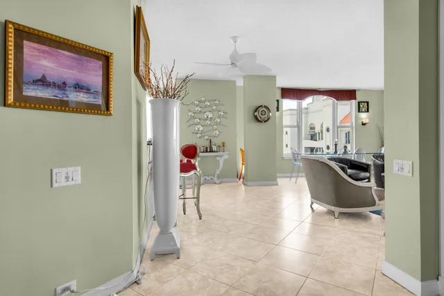 a kitchen with a table chairs and a refrigerator