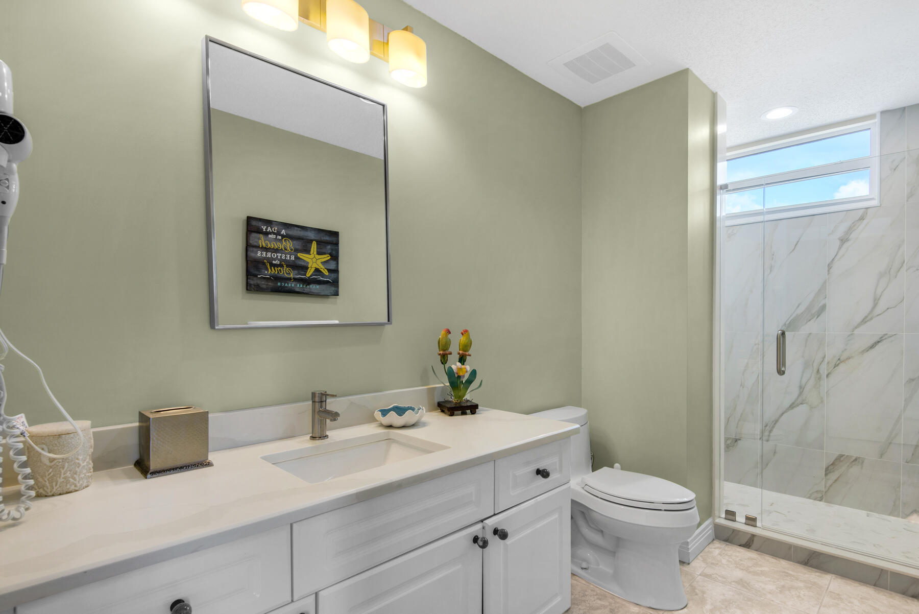 8501 Gulf Boulevard, Unit WPH3A Navarre, FL 32566 - Photo 41 of 66 a bathroom with a sink a toilet and shower