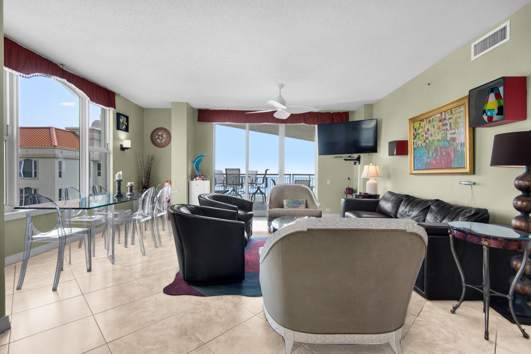 8501 Gulf Boulevard, Unit WPH3A Navarre, FL 32566 - Photo 6 of 66 a kitchen with a table chairs and a refrigerator