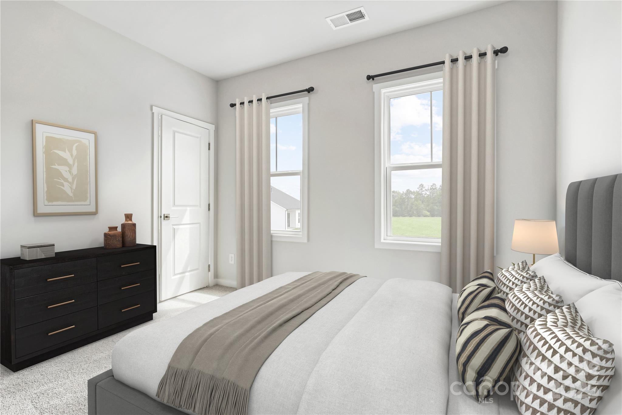 5259 Vernon Rdg Road, Unit 76 Huntersville, NC 28078 - Photo 4 of 14 a bedroom with a bed and a window