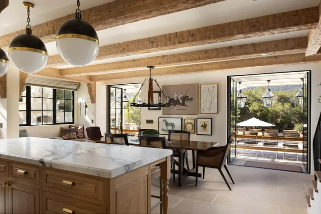 a kitchen with a refrigerator and cabinets