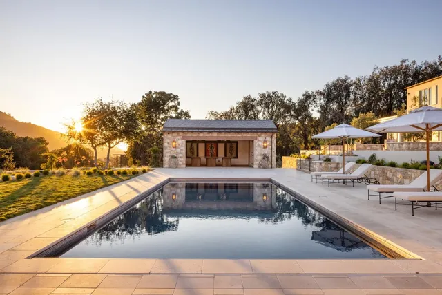 an aerial view of a house with outdoor space