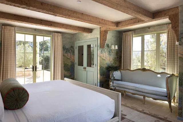 a bedroom with furniture and a window