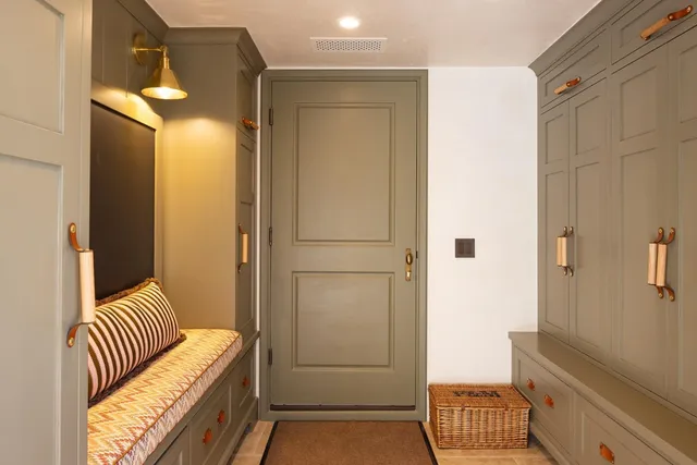 a bedroom with a balcony a bed and a fireplace