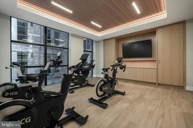 a view of a livingroom with furniture and a flat screen tv