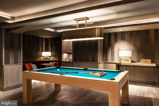 a living room with furniture a flat screen tv and a large window