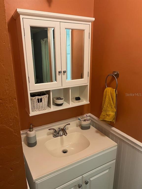 3402 Northwest 2 Street Gainesville, FL 32609 - Photo 12 of 16 a bathroom with a sink and a mirror