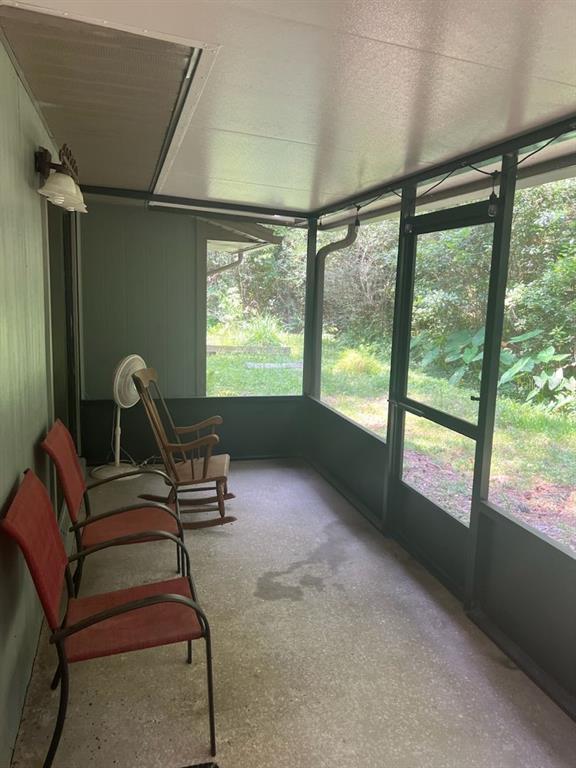 3402 Northwest 2 Street Gainesville, FL 32609 - Photo 16 of 16 a room with gym equipment and windows