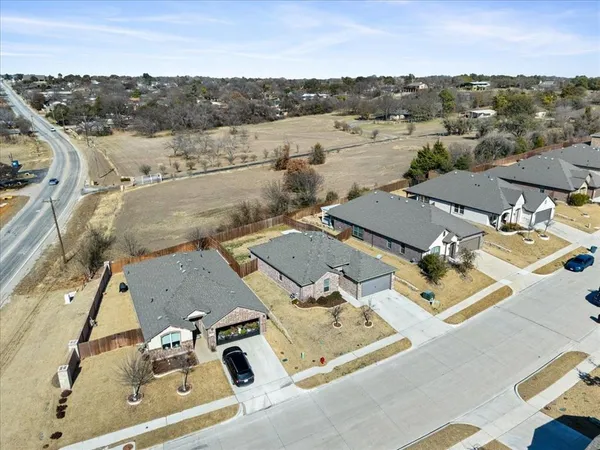 an aerial view of residential house with parking