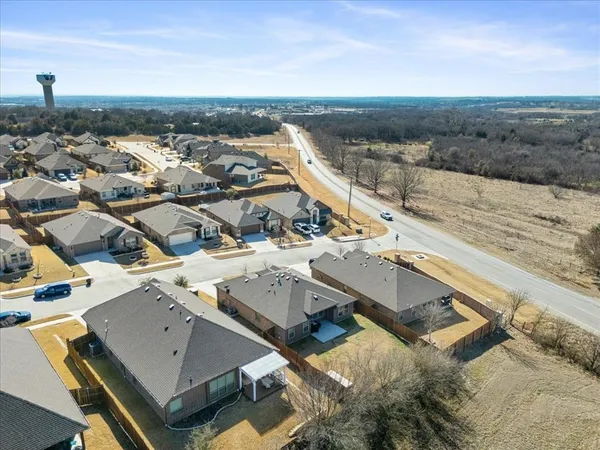 an aerial view of residential houses with outdoor space