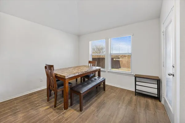 a room with furniture and wooden floor