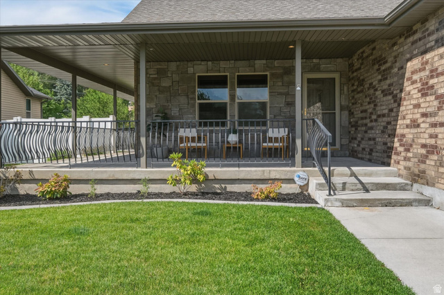 689 Apple Drive Logan, UT 84321 - Photo 34 of 52 Covered porch entry featuring stone and brick façade accents