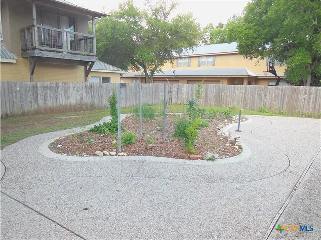 a view of a garden from a balcony