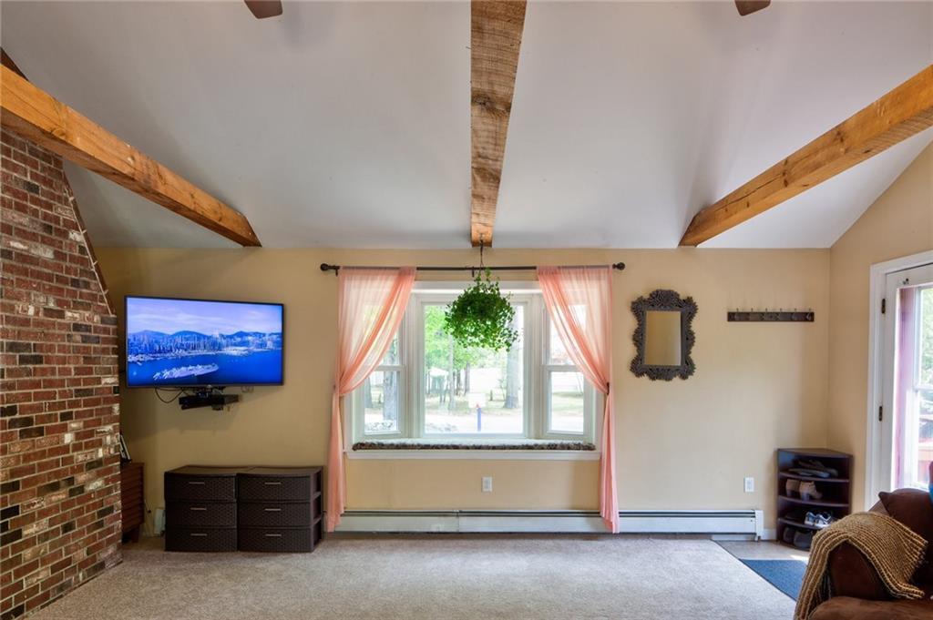 244 Mallego Road Barrington, NH 03825 - Photo 12 of 35 A window seat in the family room is...