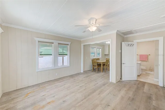 a view of a dining room with furniture and window