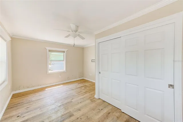 a view of a kitchen with wooden floor and a sink