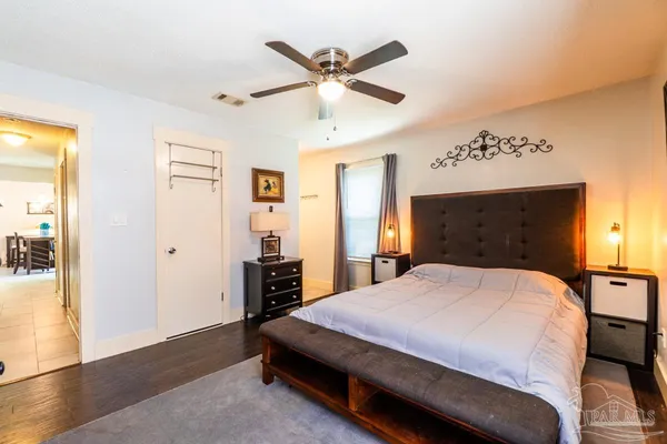 a bedroom with a bed and window