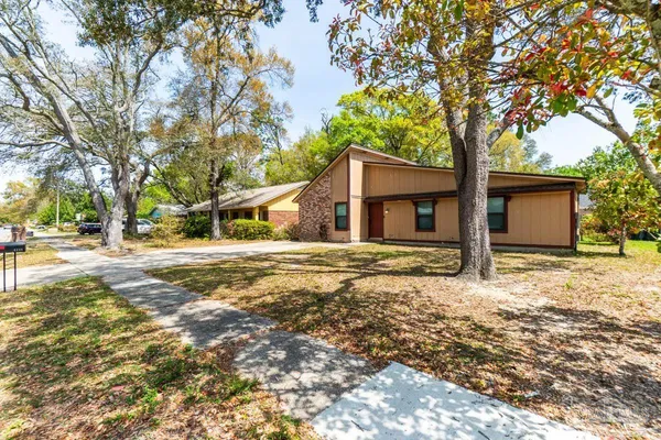 a house with trees in front of it