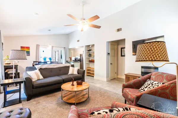 a living room with furniture and a rug