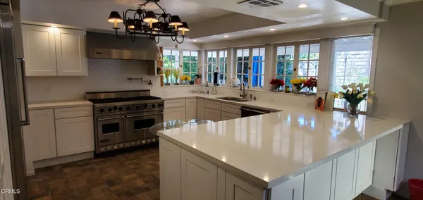 a kitchen that has a lot of cabinets in it