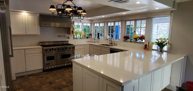 a kitchen that has a lot of cabinets in it