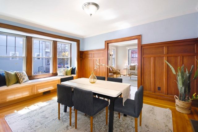 a view of a dining room with furniture window and outside view