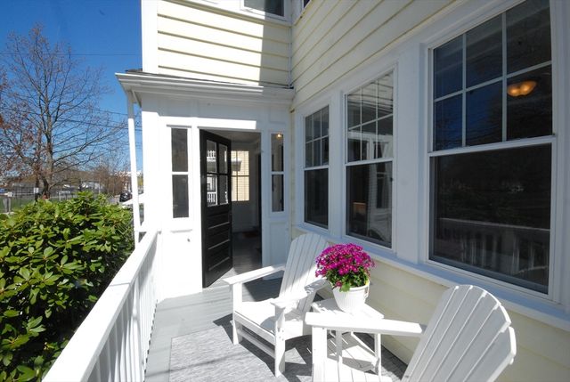 a view of a dining room with furniture and front door